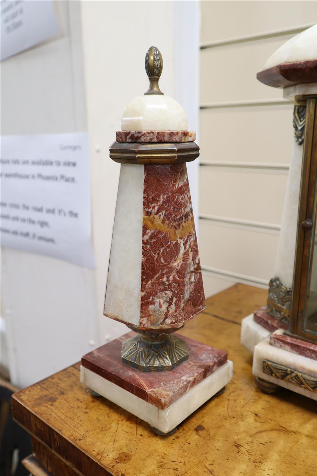 An Art Deco rouge and white marble clock garniture